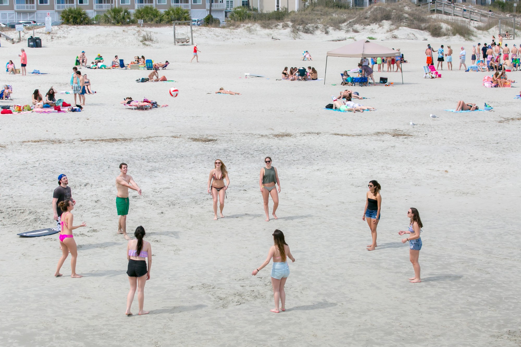 A large crowd of people on the beach.