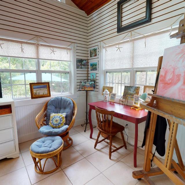Recreational room with an easel, art work , tv and seating