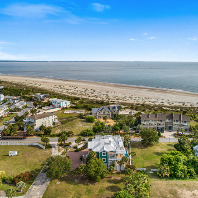 An aerial view of island homes, the beach and the ocean.
