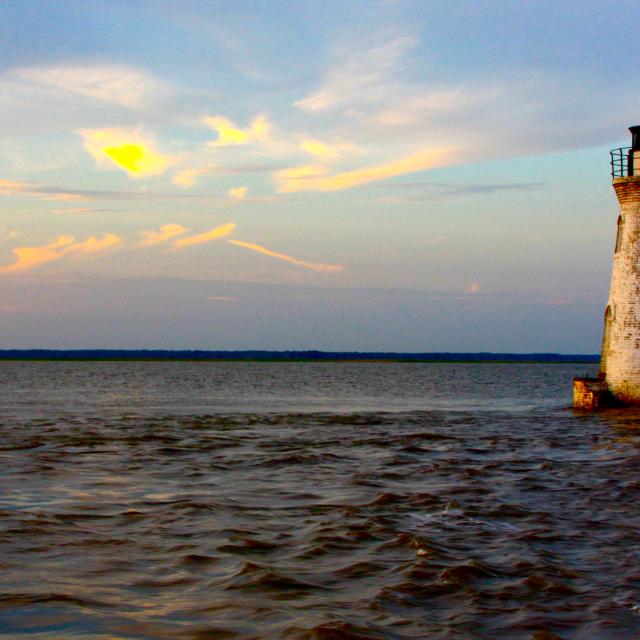 Cockspur Lighthouse at sunset on Tybee Island.