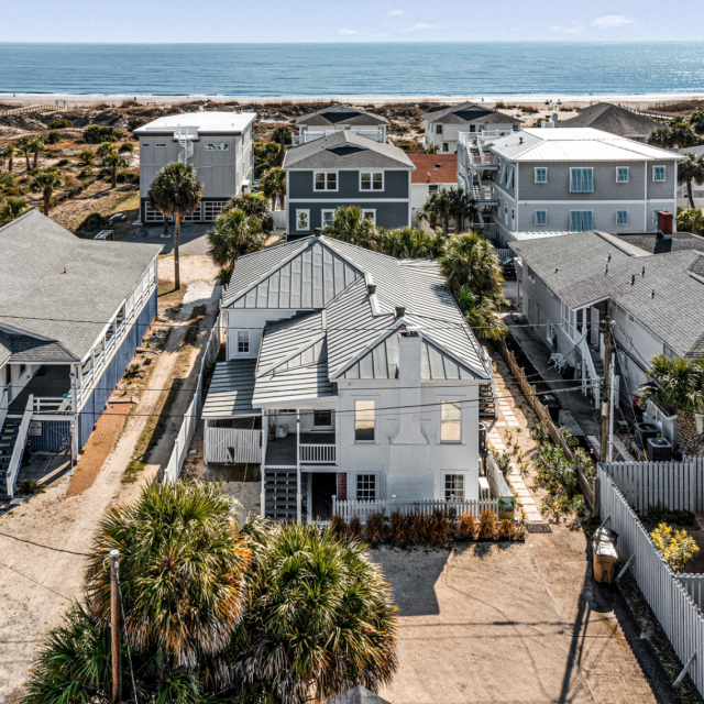 Aerial view of several island homes with view of the beach.