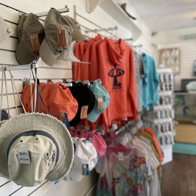 Clothes and hats hung for purchase
