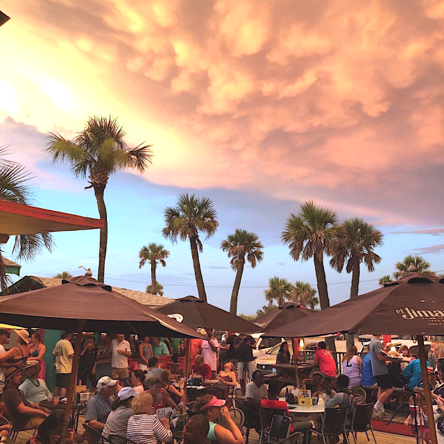 Outdoor deck dining at sunset