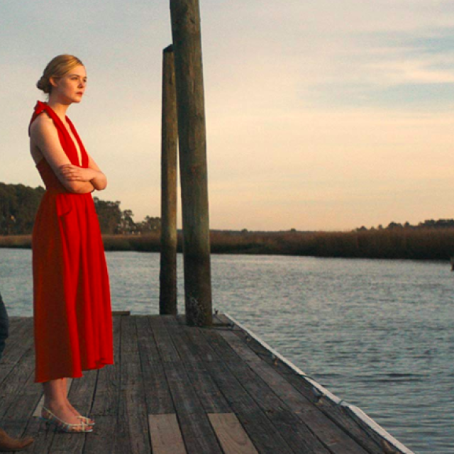 Promotional poster for the movie "Galveston," featuring lead actors against a coastal backdrop.