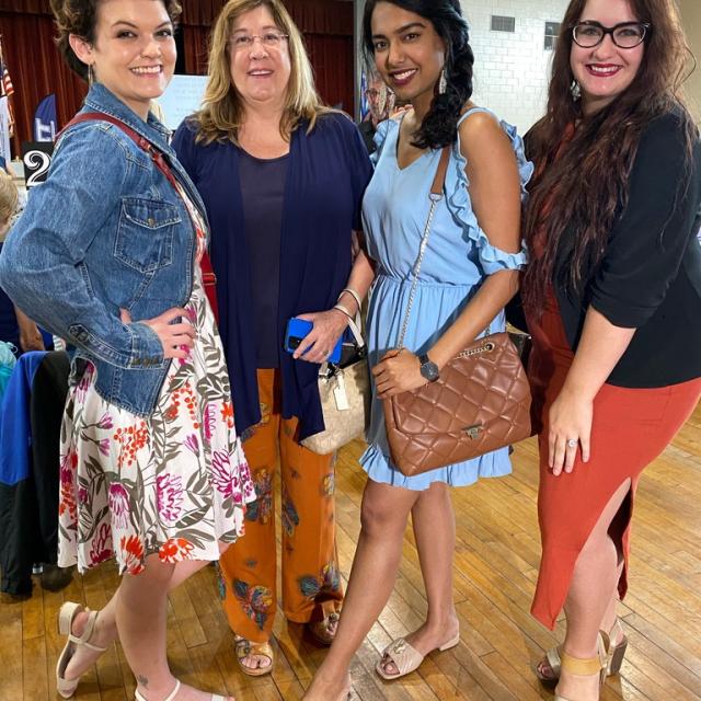Four ladies at an indoor event