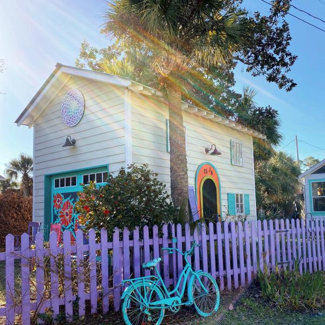 Tybee Island beach house with a purple fence and blue bike