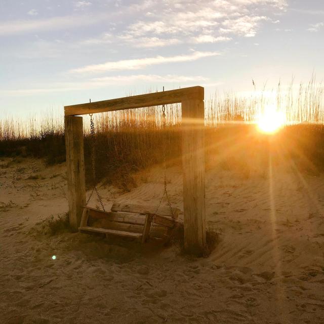Tybee Island beach swing at sunset