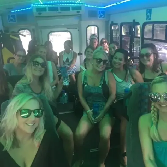 A large group of people on an island beach bus