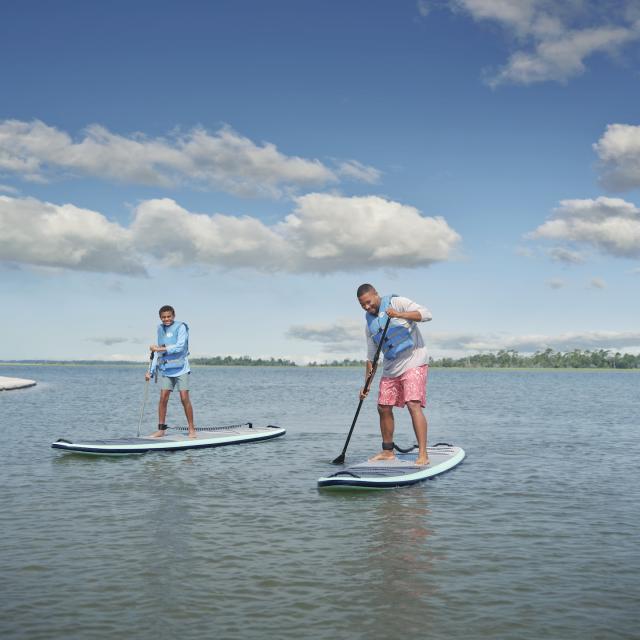 Father and son paddleboarding
