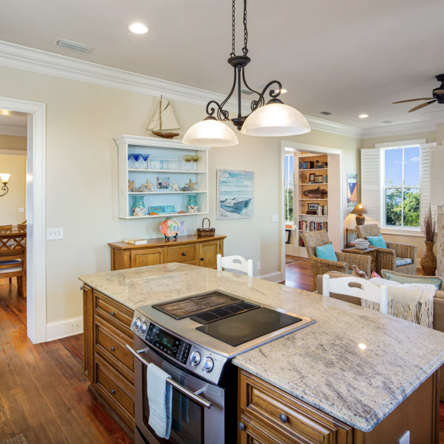 View of living room from the kitchen with a large island