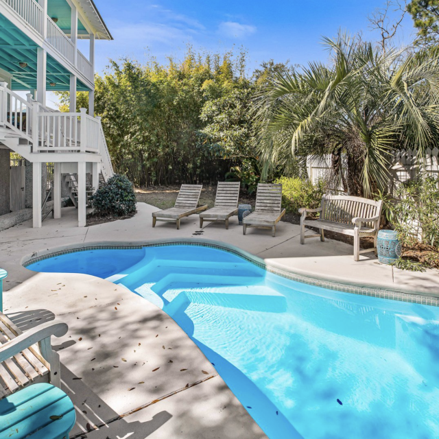 Backyard pool area with seating