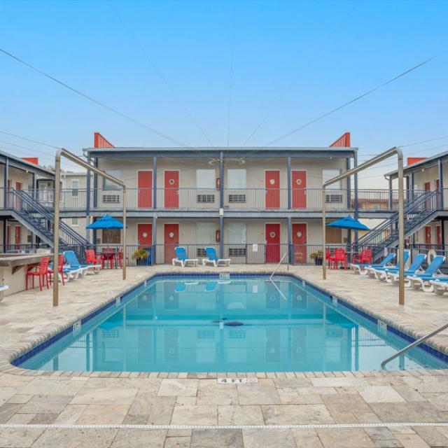 Outdoor hotel pool with ample seating