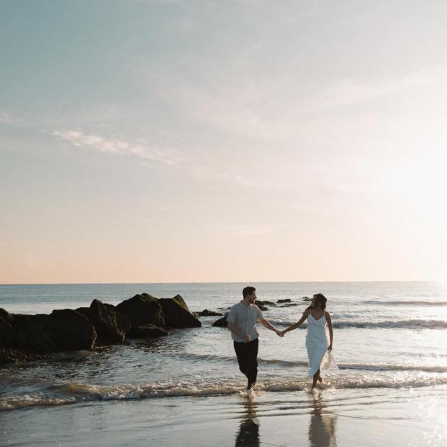 couple walking along the shore