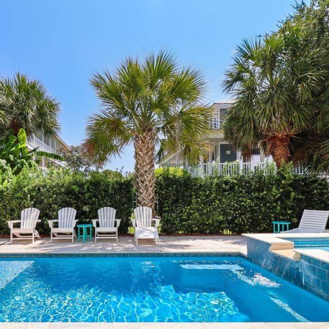 An outdoor pool area with seating.
