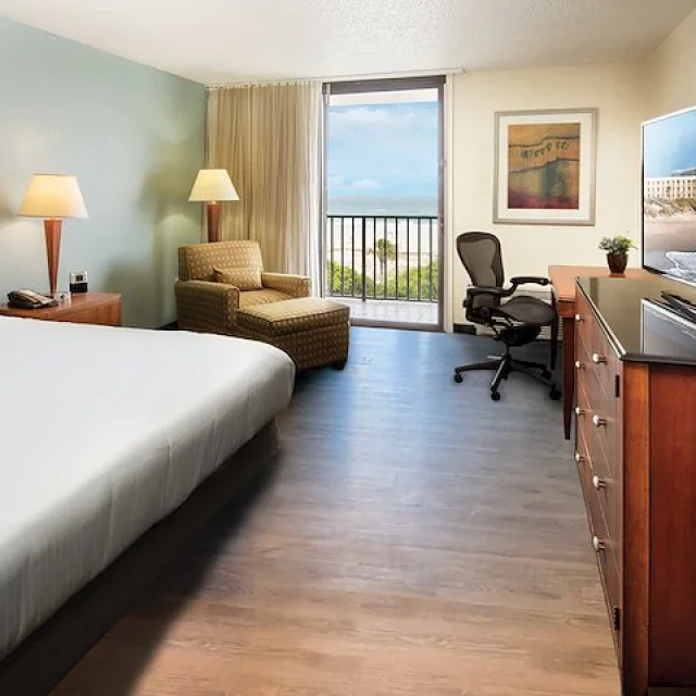 An oceanview king bed hotel room.