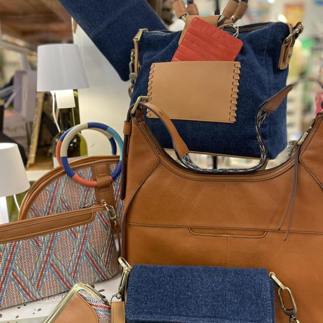 Various purses on display for purchase.