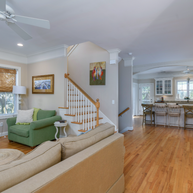 Chatham Charm vacation home interior with open living space, modern kitchen, and cozy seating.