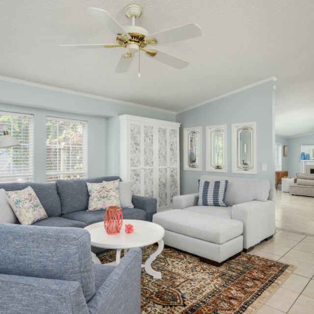 Good Tybations vacation rental interior with coastal-inspired living room and light blue accents.