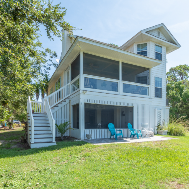 Marsh Mellow vacation rental on Tybee Island with screened porch, open yard, and marshfront views.