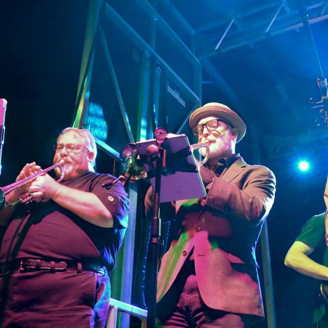 A band performing at night.