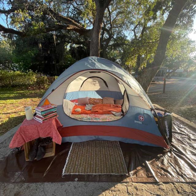 Tent campsite set up beneath large trees at River’s End Campground.