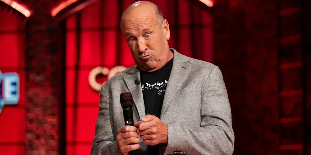A comedian performing his show on stage.
