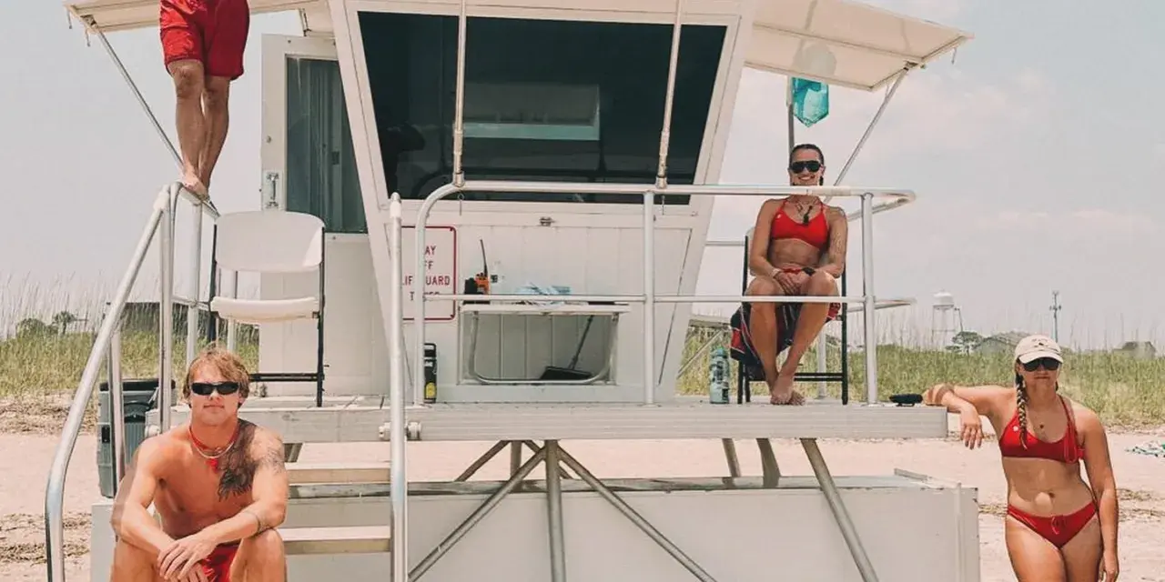 Lifeguards dressed in red beach attire on Tybee Island.