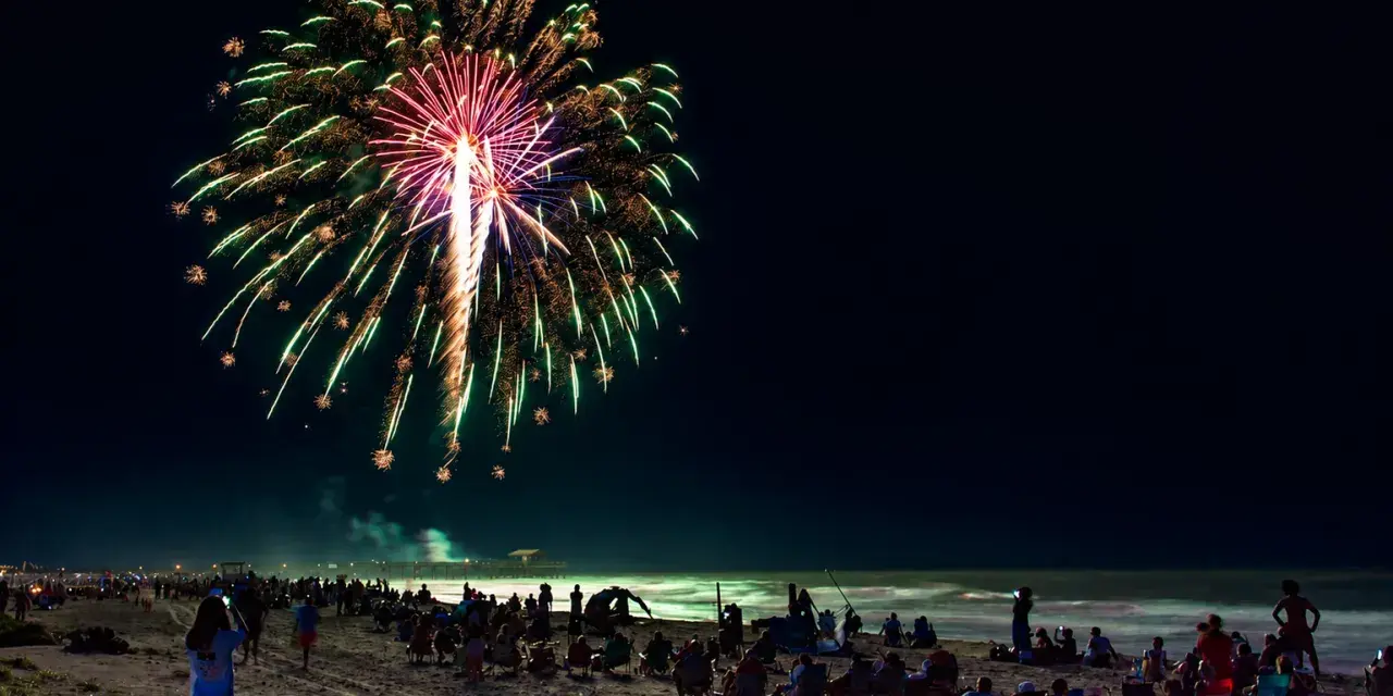 People gathered on the beach to watch the fireworks show on Tybee Island.