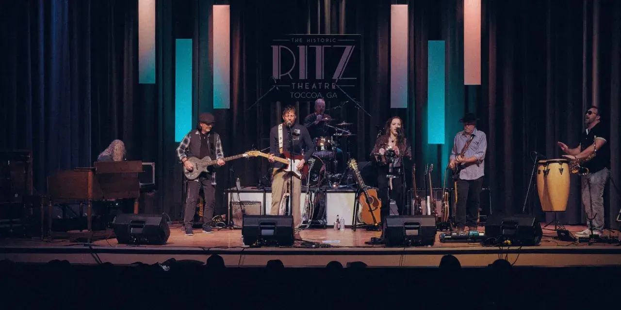 A Rolling Stones tribute band performing on stage.