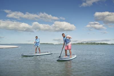 Father and son paddleboarding