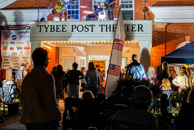 Crowd gathers outside the Tybee Post Theater for an evening performance during the Tybee Post Music Festival Lawn Party.