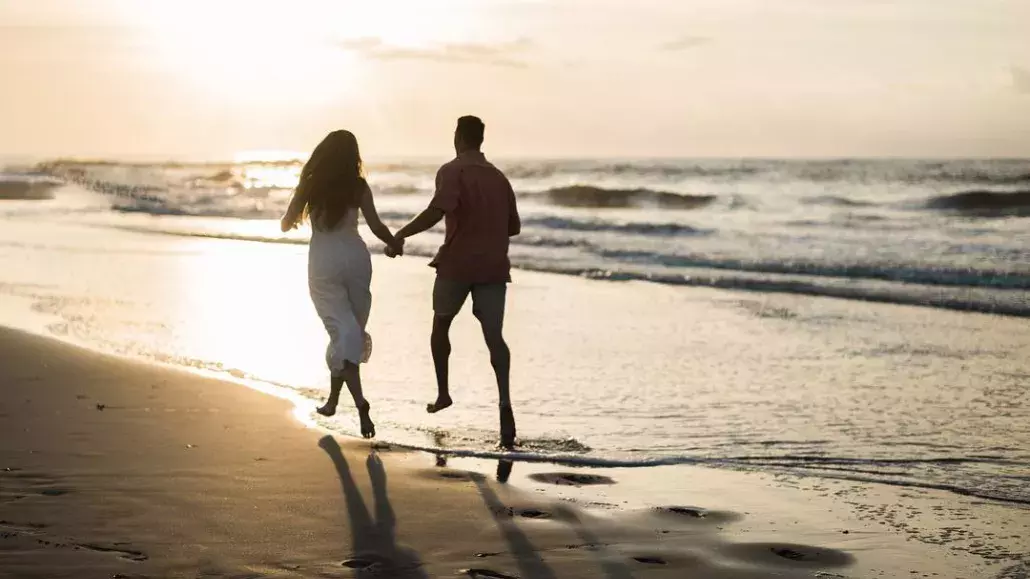 couple running beach