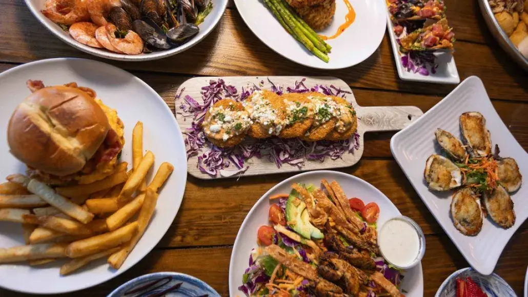 Numerous seafood and various dishes on a table.