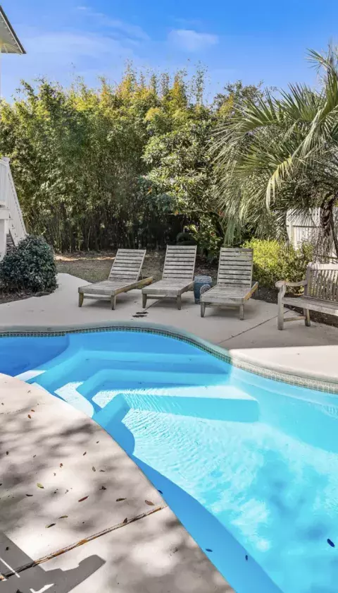 Backyard pool area with seating