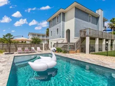 Outdoor pool view with swan floatie