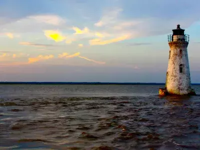 Cockspur Lighthouse at sunset on Tybee Island.