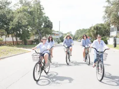 A group of five riding bikes