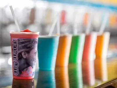 A row of colorful frozen daiquiris.