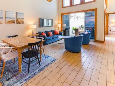A large living area with numerous windows offering beautiful sunlight.