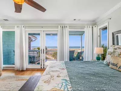 Primary king bedroom with balcony view
