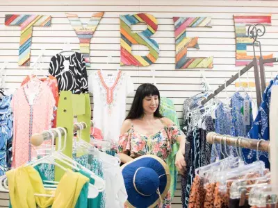 A woman shopping in a clothing store.