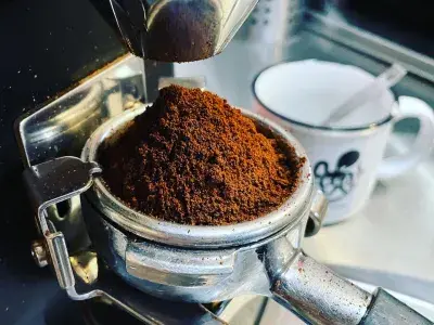 An espresso machine with ground espresso.