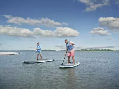 Father and son paddleboarding