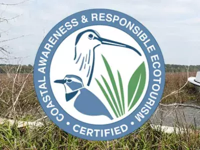 CARE certification program logo with marshlands and people on a boat in the background