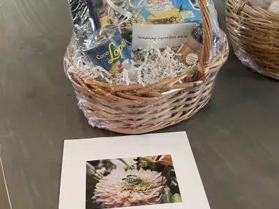 A congratulatory wedding gift basket on a table