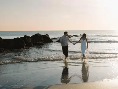 couple walking along the shore