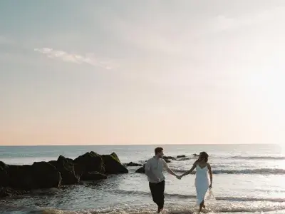 couple walking along the shore