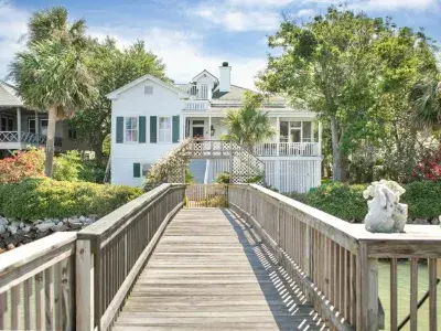 An expansize deck leading to a massive beach home.