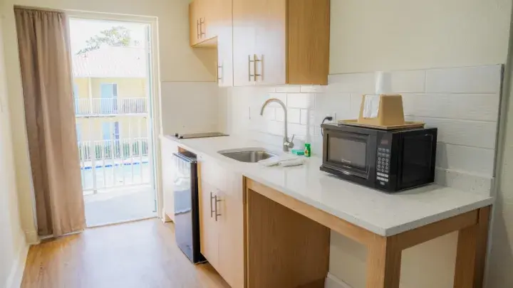 Modern vacation rental kitchen with full appliances and bar seating.