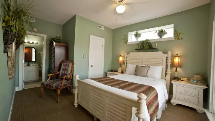 A room suite with a bed seating and ensuite.